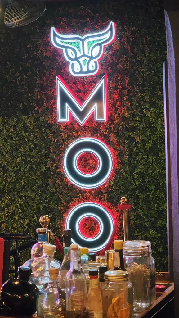 lighted sign for Moo restaurant.