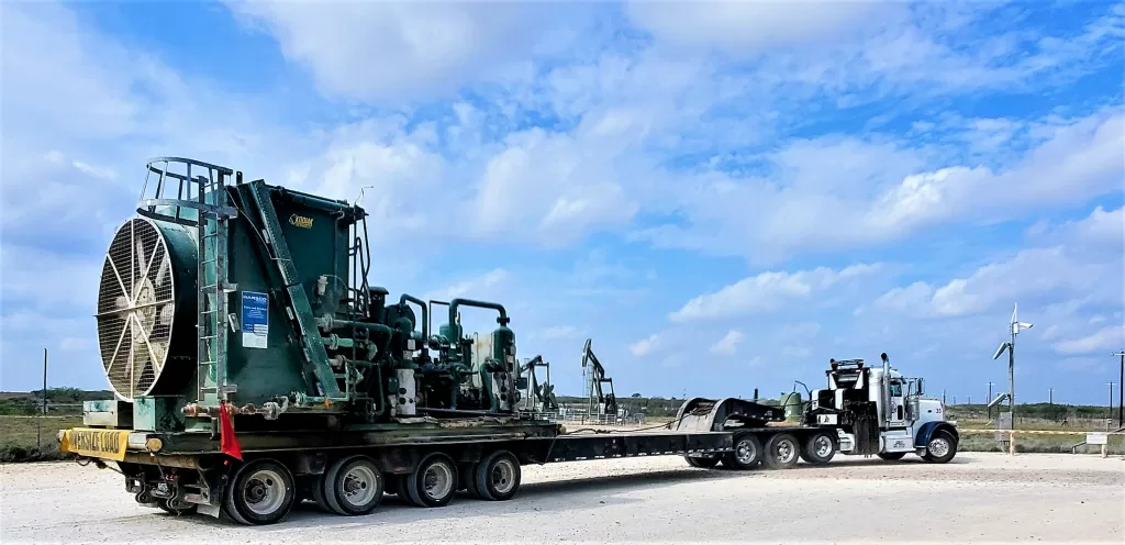 Gate Guarding: Work Camping Jobs For Full-Time Rvers 2024 10 Huge piece of heavy equipment exiting a drilling site.