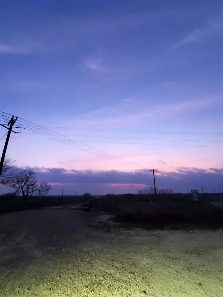 Gate Guarding: Work Camping Jobs For Full-Time Rvers 2024 13 Purple blue and pink sunrise.