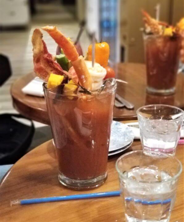 40+ Fascinating Things To Do In Vegas Besides Gamble 2024 29 Bloody mary with crab legs, shrimp and cheese garnish.