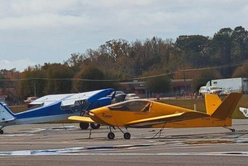 Manatees And More: 25 Things To Do In Crystal River, Florida 2025 29 Two small aircraft parked on an airfield. In the foreground, there is a yellow experimental aircraft labeled