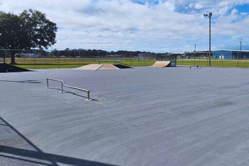 Manatees And More: 25 Things To Do In Crystal River, Florida 2025 32 An outdoor skate park with a smooth concrete surface, featuring several ramps, rails, and obstacles for skaters.