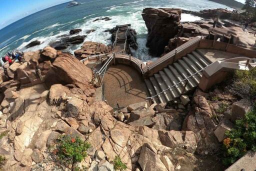 Beaches In Acadia National Park: More Than Just Sand 5 Rocky coastal overlook with stairs leading down to thunder hole, where waves crash against the cliffs.