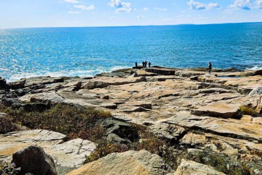 The Ultimate Acadia National Park Itinerary For 2025: Your Perfect 3-Day Plan 16 Schoodic point’s rocky coastline in acadia national park, with ocean waves, rugged terrain, and visitors enjoying the scenic view.