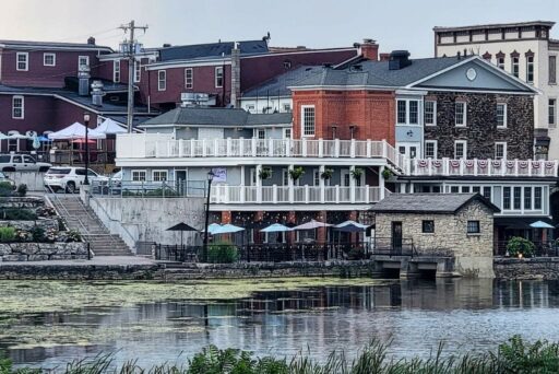 30 Best Things To Do In Batavia, Ny In 2025 26 Charming riverside buildings in le roy, ny, with outdoor seating, stone architecture, and reflections on the water’s surface.