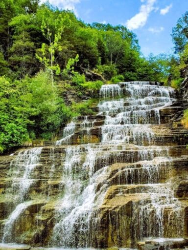 The Ultimate Guide To 30 Easy Finger Lakes Waterfalls With Map 2025 6 Towering hector falls pouring down layered cliffs, a breathtaking finger lake waterfalls view.