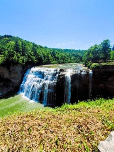 The Ultimate Guide To 30 Easy Finger Lakes Waterfalls With Map 2025 16 Middle falls at letchworth state park, cascading powerfully over cliffs into a wide green pool, framed by forest.