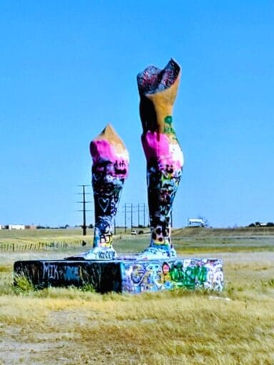 17 Weird Things To Do In Amarillo (2025) 16 Graffiti-covered giant leg sculpture in amarillo field—one of the weirdest things to do in amarillo, texas.