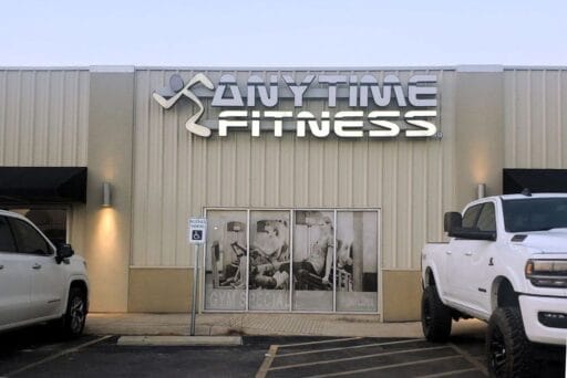 What Stores Allow Overnight Parking 2025 2 Anytime fitness storefront with rv-friendly lot showing what stores can i park in overnight for short stays.