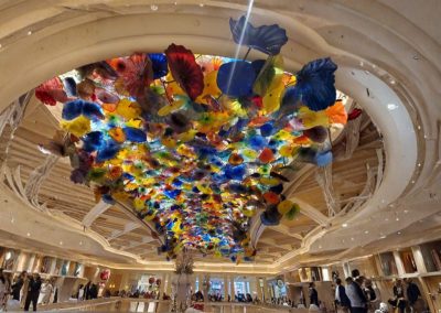 Chihuly glass ceiling in bellagio las vegas with colorful blown glass flowers installation