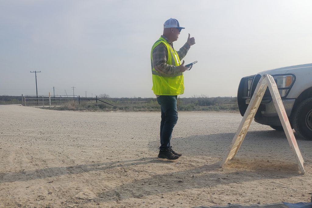 Rv gate guarding worker checking trucks at oil field entrance while working full time rv lifestyle