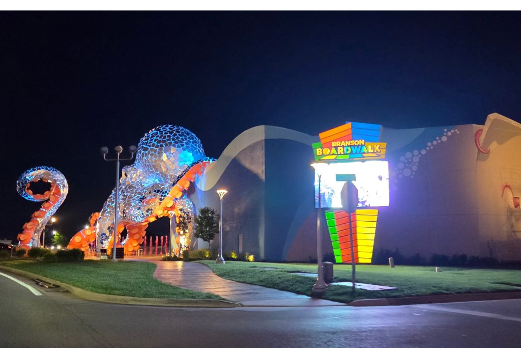 Missouri Road Trip Itinerary: Branson, The Ozarks &Amp; Beyond 21 Giant illuminated octopus sculpture outside branson boardwalk at night with colorful lights welcoming visitors.