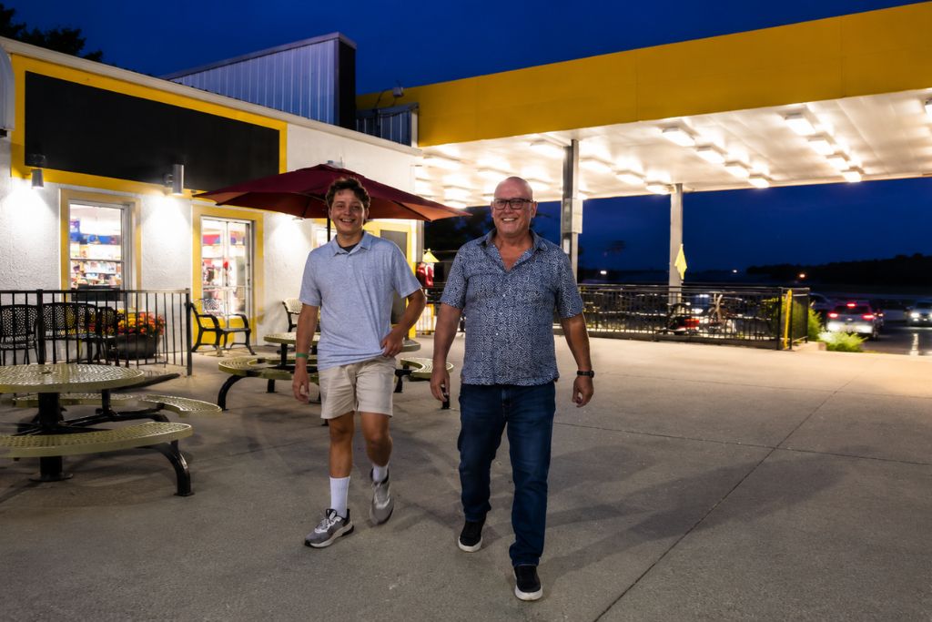 Missouri Road Trip Itinerary: Branson, The Ozarks &Amp; Beyond 22 Grandfather and grandson smiling as they walk together after racing go-karts during an evening in branson.