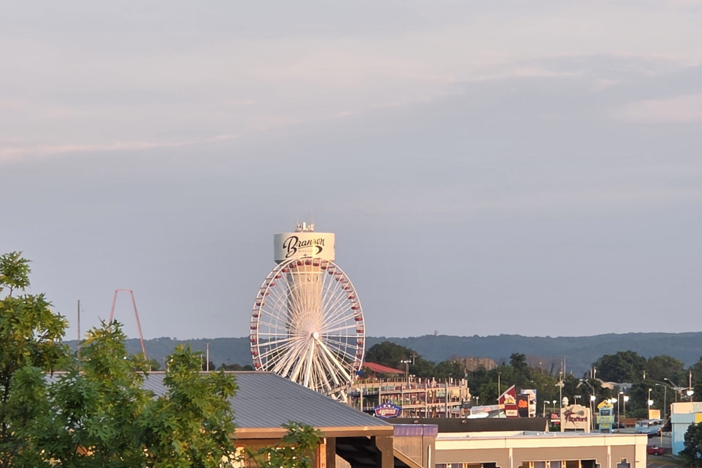 Is Branson Worth Visiting? Our Thoughts After Three Days 15 The branson ferris wheel rises above the city's entertainment district with the ozark hills in the background. After spending three days exploring the area, we found plenty of reasons to say branson is worth visiting.