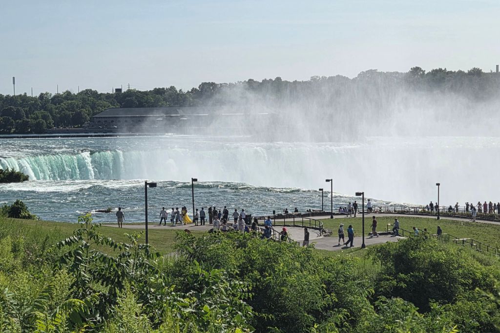 Is Niagara Falls Worth Visiting? What We Think After Several Visits 6 Horseshoe falls curves across the niagara river as heavy mist rises in front of visitors gathered at terrapin point. The american side viewing area on goat island puts visitors close to the rushing water with a wide view across the falls.