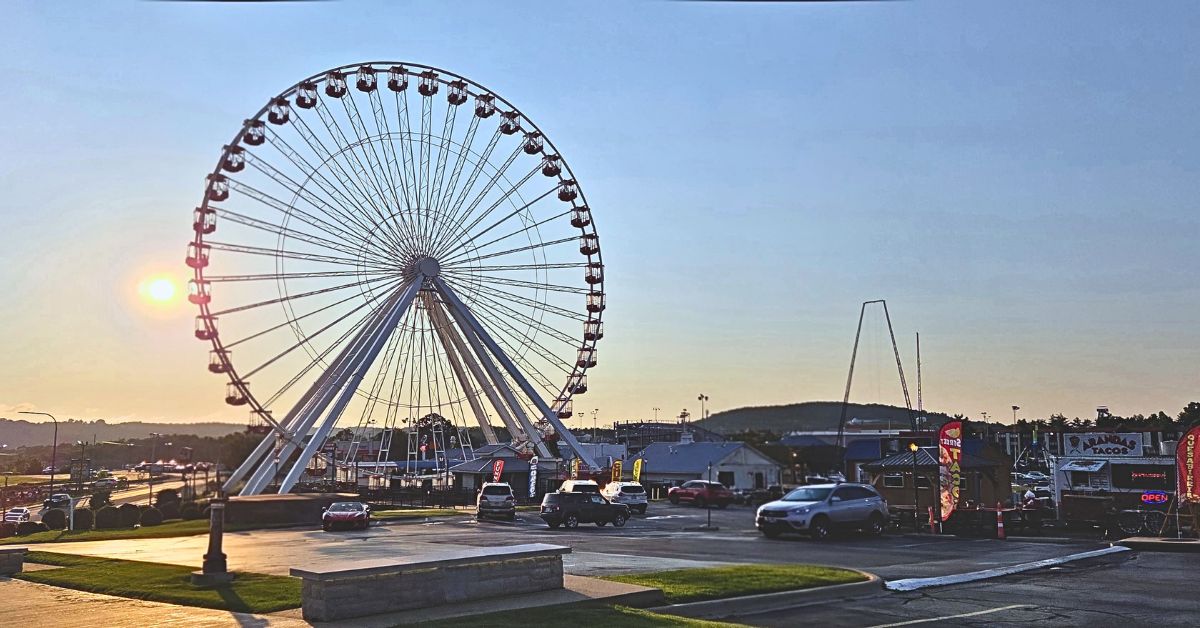 Is Branson Worth Visiting? Branson Ferris Wheel at Sunset The Branson Ferris Wheel stands against a sunrise with attractions and the Ozark hills in the background. The iconic view captures why we believe Branson is worth visiting after spending three days exploring the city.