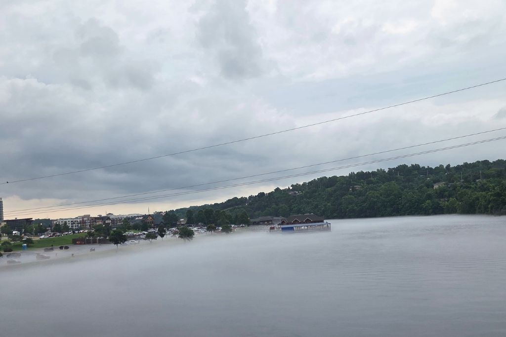 Is Branson Worth Visiting? Our Thoughts After Three Days 7 Dense morning fog blankets the water as we drive into branson, with the ozark hills rising above the mist in the distance. The unexpected fog created a memorable first impression of our visit.