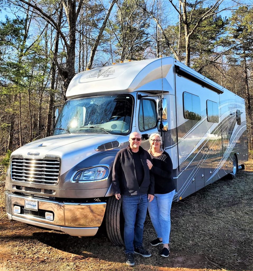 Robb And Maureen With Their Renegade Verona Robb and maureen smiling in front of their renegade verona le super c motorhome