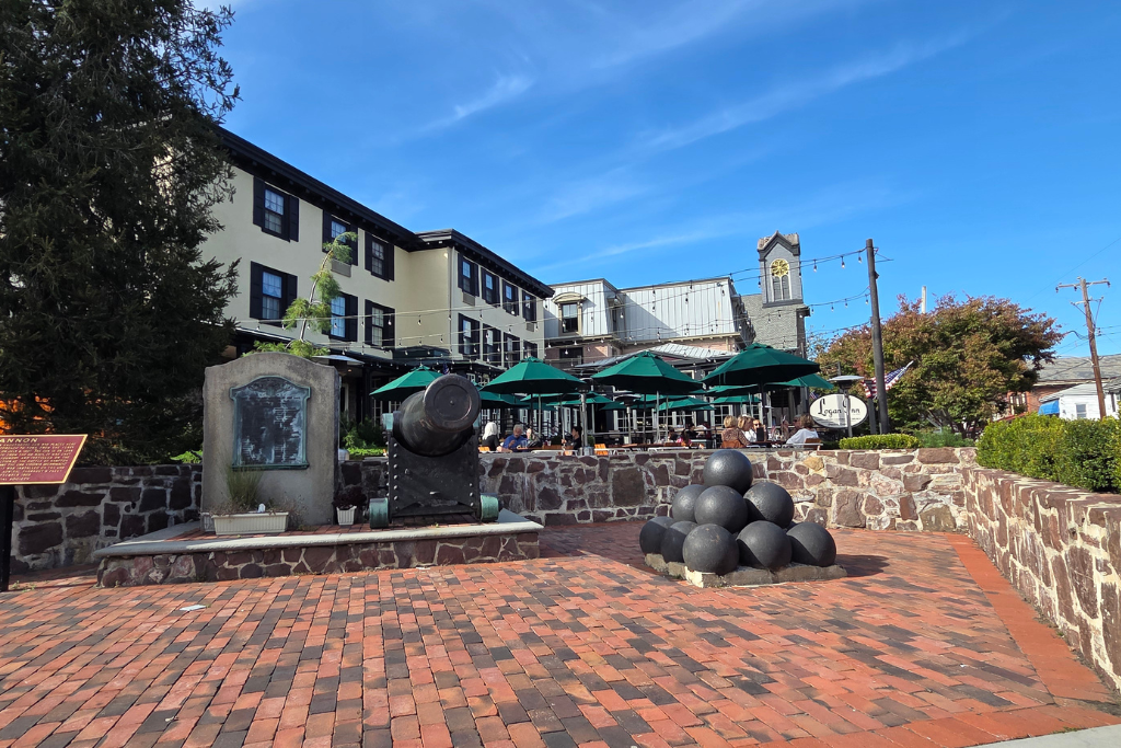 Logan Inn Historic Hotel And Outdoor Patio In New Hope Pa Historic logan inn in new hope features an outdoor dining patio with green umbrellas overlooking a brick courtyard and cannon.